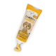 Eine Tube "Cheesy Squeezie" Käsecreme für Hunde, mit einem Cartoon-Hund auf dem Etikett, mit Text in Deutsch und Englisch.