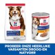 Hill's Science Plan huisdiervoedselverpakking voor volwassen honden (11-25 kg) met kip, gelabeld "Volwassen Volwassen 7+" en "Aanbevolen door dierenartsen."