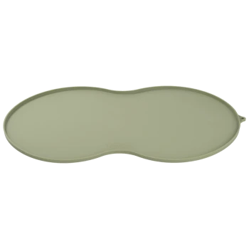 Green silicone pet feeding mat with an oval shape, designed to catch spills and keep feeding area clean.