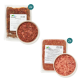 Rohes Rindfleisch-Hundefutter in zwei vakuumversiegelten Verpackungen und einer Schüssel, beschriftet mit "Rinderfleisch, 500 g" mit Zutaten und Fütterungshinweisen.