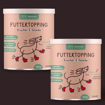 Zwei 250g Behälter mit veganem "Futtertopping" für Hunde, beschriftet mit "Knochen & Gelenke", mit einer verspielten Hundillustration.