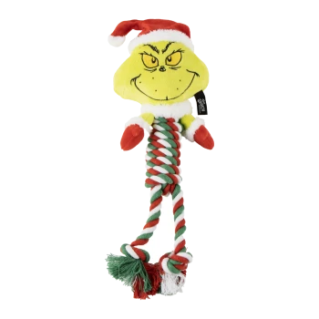 The Grinch plush dog toy wearing a Santa hat with red, white, and green rope legs and mittens.