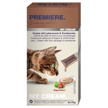 Die Verpackung des Katzenfutters zeigt eine Nahaufnahme des Katzenkopfes, beschriftet mit "PREMIERE. Ich liebe meine Katze," mit Details über Leberwurst und Preiselbeeren.