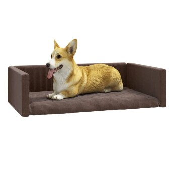 Ein entspannter Corgi liegt auf einem plüschigen, braunen Hundebett mit erhöhten Seiten und zeigt ein gemütliches Haustierzubehör.