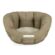 Ein gemütliches, rundes Tierbett in neutralem Beige mit einem weichen, plüschigen Innenraum und einem sichtbaren "Doctor Bark"-Logo an der Seite.