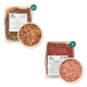 Zwei Haustierfutterpackungen: 'Rindfleisch-Gemüse-Mix' (Rindfleischmix, 4 Portionen) und 'Lammminschung' (Lamm-Mix, 1 Portion) mit Schüsseln.