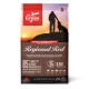 Eine Tüte Orijen Regional Red Hundefutter mit einem Sonnenuntergang im Hintergrund, die Text über Ernährung und Zutaten zeigt. Nettogewicht: 11,4 kg (25 lb).