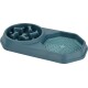 Blue plastic slow feeder pet bowl with raised bone-shaped obstacles and textured paw print section.