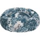 Un lit pour animaux confortable avec un motif de feuilles tropicales dans des teintes de bleu canard et blanc, conçu pour le confort et le style.