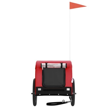 Roter Haustieranhänger mit einem schwarzen Netzfenster, zwei Rädern und einer orangefarbenen Sicherheitsflagge oben.