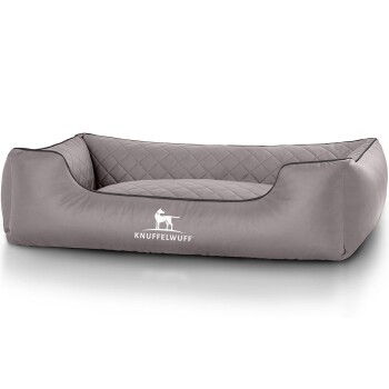 Graues Haustierbett mit gestepptem Design und erhöhten Rändern, mit dem Logo 'KNUFFELWUFFF' auf der Vorderseite.