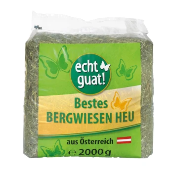 Packung "echt guat!" bestes Bergwiesenheu, 2000g, mit grün-gelbem Design, Schmetterlingen und der österreichischen Flagge.