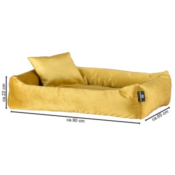 Ein plüschiges gelbes Haustierbett mit einem weichen Kissen und einem kleinen Kissen, das ungefähr 90 cm mal 65 cm und 22 cm hoch misst.