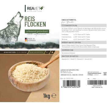 Reavet Reis Flocken Hundefutterverpackung, mit einer Holzschüssel Reisflocken, einer Wolf-Illustration und Nährwertinformationen auf Deutsch.