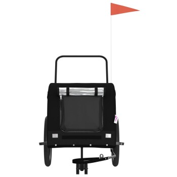 Schwarzer Haustieranhänger mit einem Reißverschluss-Rückentasche, zwei Rädern und einer Sicherheitsflagge, entworfen für den Transport von Haustieren.