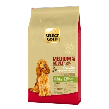 Hundefutterverpackung mit einem goldenen Cocker Spaniel, beschriftet mit "SELECT GOLD MEDIUM ADULT Sensitive" mit Zutaten aus Ente und Kartoffel.