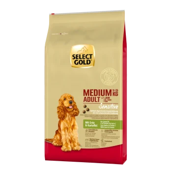 Dog food package featuring a golden cocker spaniel, labeled "SELECT GOLD MEDIUM ADULT Sensitive" with duck and potato ingredients.