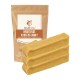Hundekau-Sticks von Wildfang, beschriftet mit "Hartkäse Kaustab Bunky," mit einer braunen Tüte und drei gelben Sticks davor.