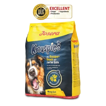 Tüte mit Josera Knuspies Hundeleckerlis mit dem Gesicht eines Hundes. Text: "Der Knusper-Snack mit zarter Ente" und "Wenig Fett." Zertifiziert "EXCELLENT."