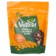 Orange-grüne Verpackung der Vutteri veganen Hundesnacks mit Karotten, Mandarine und einem Hund, der sich die Lippen leckt.