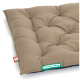 Ein plüschiges, beige Haustierbett mit gepolstertem Design und einem grünen 'Doctor Bark'-Label an der Seite, das auf einer weißen Oberfläche ruht.