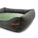 Ein plüschiges, rechteckiges Haustierbett mit einem dunkelgrauen Äußeren und einem weichen grünen Innenkissen, mit einem braunen Etikett, auf dem "RexProduct.com" steht.