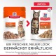 Die Verpackung von Hill's Science Plan Katzenfutter zeigt eine getigerte und graue Katze, mit den Aufschriften "Vom Tierarzt empfohlen," "Erwachsene 1-6," und "mit Truthahn."