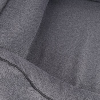 Graues Haustierbett mit einem weichen, strukturierten Stoff und einer abgerundeten Kante, ideal für kleine bis mittelgroße Haustiere.