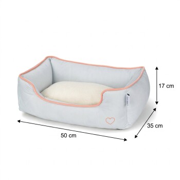 Light gray rectangular pet bed with peach trim and cream cushion and heart logo; dimensions labeled 50 cm × 35 cm × 17 cm