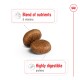 Two round pet food kibble pieces with text highlighting "Blend of nutrients & vitamins" and "Highly digestible proteins."