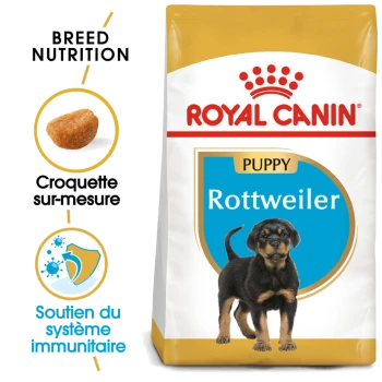 Sac de nourriture pour chiots Royal Canin Rottweiler avec une image de chiot Rottweiler, avec un texte mettant en avant la nutrition de la race et le soutien immunitaire.