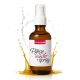 Braune Sprühflasche mit der Aufschrift „HerzensTier Pflege wunder spray“ mit weißem Sprühkopf und Hintergrund mit Flüssigkeitsspritzern.