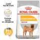 Sac de nourriture pour chiens Royal Canin Dermacomfort Medium mettant en vedette un chien Shar Pei, avec un texte soulignant la réduction des allergènes et 91 % de satisfaction des propriétaires.