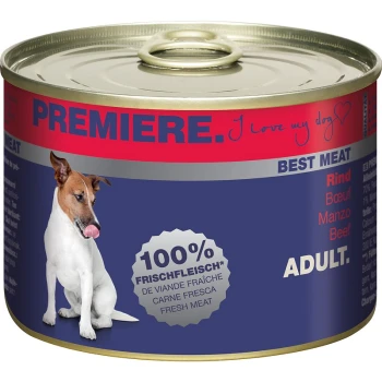 Une boîte de nourriture pour chiens "Premiere" avec un chien blanc se léchant les lèvres, étiquetée "100 % Frischfleisch," "Meat de qualité," et "Adult."