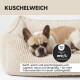 Orthopädisches Hundebett mit Memory-Schaum-Technologie, gepolsterten Seitenkissen und einem braunen Hund, der darauf sitzt.