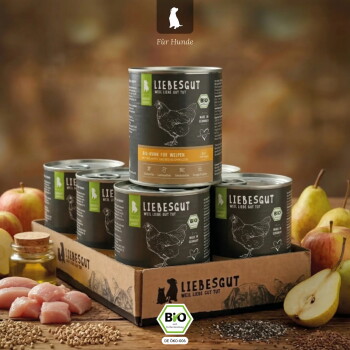 Liebesgut Dosen in Schale mit Hühnerzeichnung, BIO-Label, Äpfeln, Birne und Getreide sowie sichtbarem Schriftzug 'Für Hunde'.