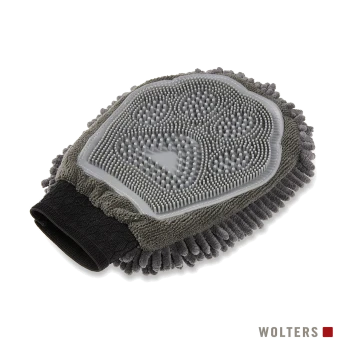 Grauer Fellpflegehandschuh mit Silikonborsten, Chenille‑Fransen und schwarzem Elastik-Handgelenkband; 'WOLTERS'-Logo sichtbar.