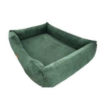 Grünes Cord-Haustierbett mit erhöhten Rändern, das einen gemütlichen Ruheplatz für Haustiere bietet.