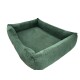 Grünes Cord-Haustierbett mit erhöhten Rändern, das einen gemütlichen Ruheplatz für Haustiere bietet.