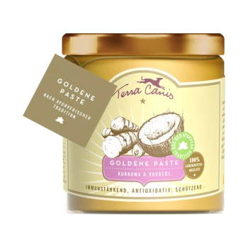 Ein Glas Terra Canis Goldene Paste mit Kurkuma und Kokosöl, mit einem Etikett, das "Goldene Paste nach ayurvedischer Tradition" liest.