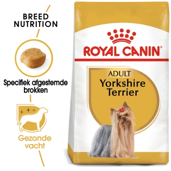 Royal Canin Adult Yorkshire Terrier hondenvoer zak met een Yorkshire Terrier met een strik, die voeding specifiek voor het ras en een gezonde vacht benadrukt.