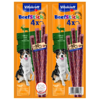 Vitakraft BeefStick Verpackung zeigt vier Fleischstangen mit einem schwarz-weißen Hund auf jeder Seite. Highlights: "90% Fleisch," "zuckerfrei," "extra Vitamine."