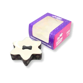 Star-shaped pet cake with creamy top, patterned brown sides and a dark bone-shaped dog treat on top.