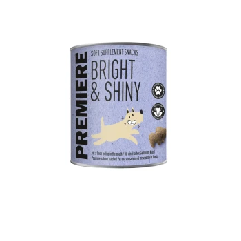 Premiere Bright & Shiny weiche Ergänzungsleckerlis für Haustiere, mit einer Illustration eines lächelnden Hundes und Symbolen für Produktvorteile.