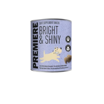Premiere Bright & Shiny zachte supplementen snacks voor huisdieren, met een illustratie van een lachende hond en productvoordelen iconen.