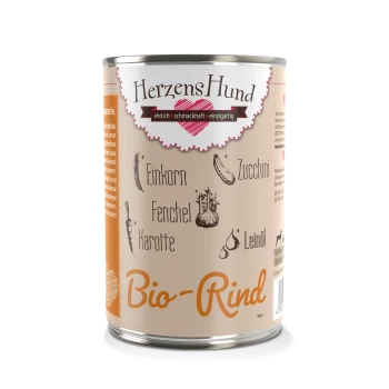 Een blik hondenvoer gelabeld 'HerzensHund Bio-Rind', met ingrediënten zoals emmer, courgette, venkel en wortel, met een hartlogo.