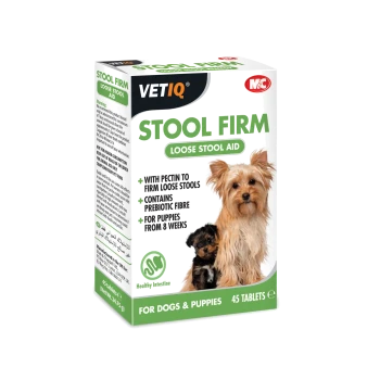 Box of VETIQ Stool Firm Loose Stool Aid for dogs and puppies, featuring two dogs on the front, with 45 tablets and claims of prebiotic fiber.