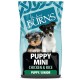 A bag of Burns Puppy Mini dog food featuring two puppies, a Yorkshire Terrier and a Jack Russell, with the text "PUPPY MINI CHICKEN & RICE."