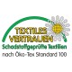 Öko‑Tex-Label 'TEXTILES VERTRAUEN' mit grünem Bogen und Blume; Text: 'Schadstoffgeprüfte Textilien nach Öko‑Tex Standard 100'.