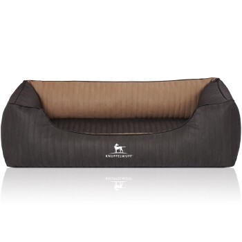 Ein stilvolles Hundebett in Dunkelgrau mit einer gerippten Textur und einem beigen Innenraum, mit dem Logo 'KNUFFELWUFF' deutlich sichtbar.